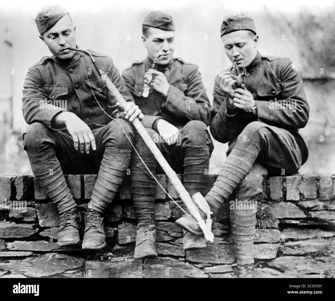 Three American Soldiers smoking Pipes at end of World War I, Cochem, Germany, Bain News Service, 1919 Stock Photo