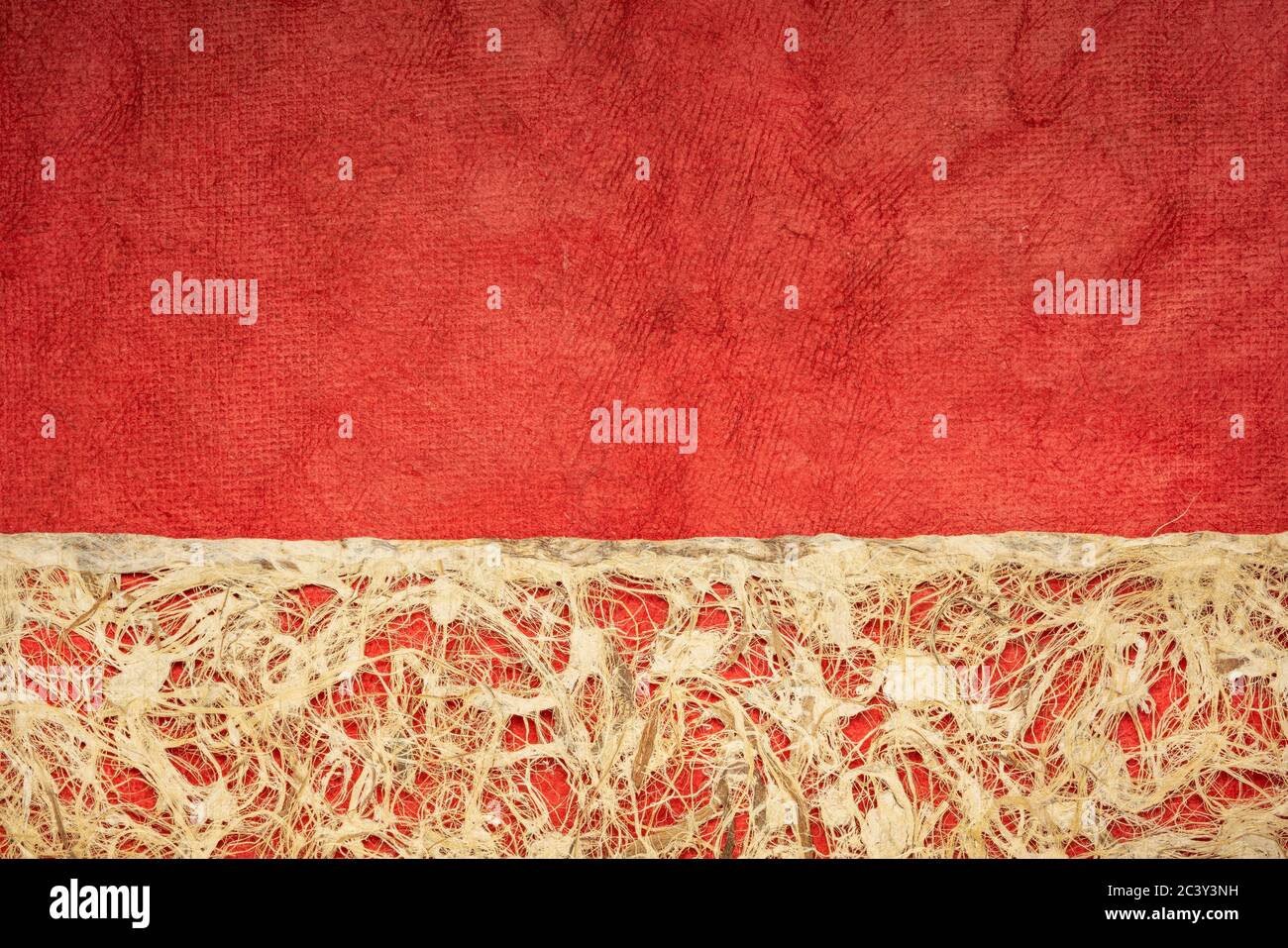 Amate bark paper with lace design against red huun paper.  This ancient paper dates back to pre-Columbian and Meso-American times and is still hand ma Stock Photo