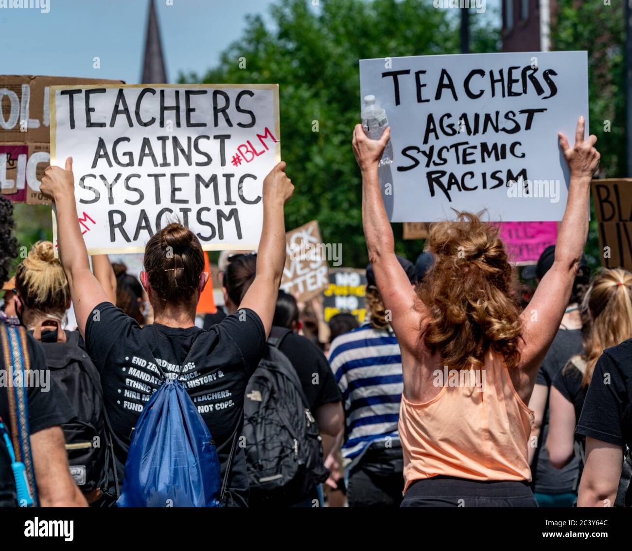June 22, 2020, Boston, Massachusetts, USA: Protesters rally holding signs 'Teachers against systemic racism' during a Black Lives Matter rally in a response to a death of Rayshard Brooks and against police brutality and racism in Boston. Credit: Keiko Hiromi/AFLO/Alamy Live News Stock Photo