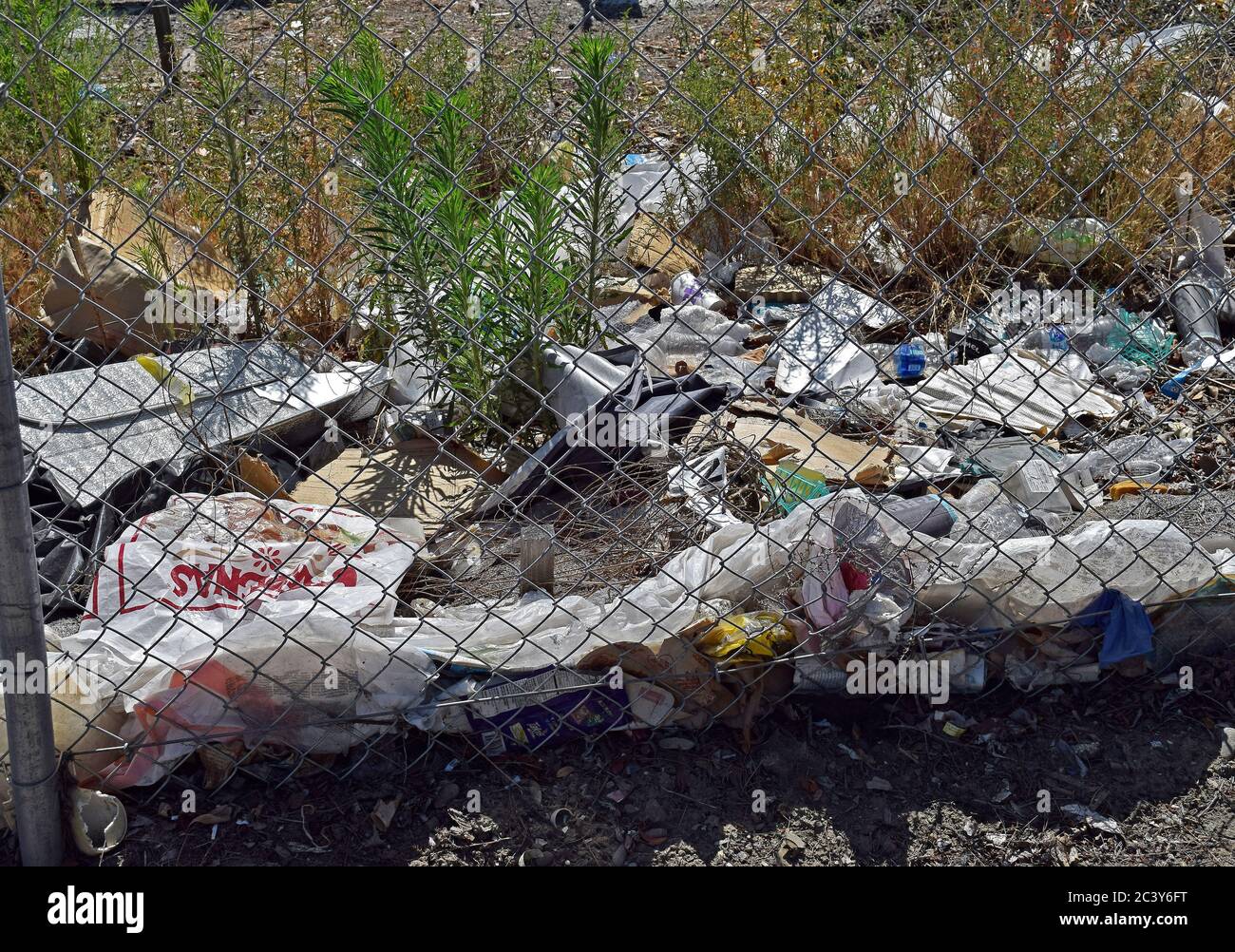 trash including plastics along 880 freeway shoulder in Union City, California Stock Photo