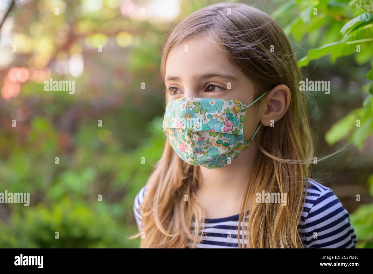 Blond girl with mask hi-res stock photography and images - Alamy