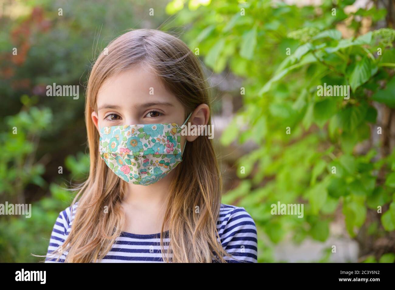 Blond girl with mask hi-res stock photography and images - Alamy