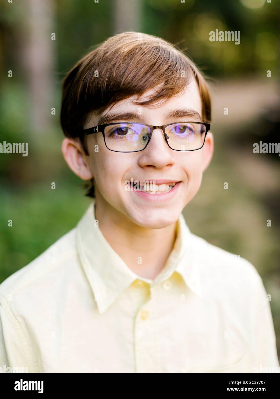 Portrait of smiling teenage boy (14-15) in eyeglasses Stock Photo
