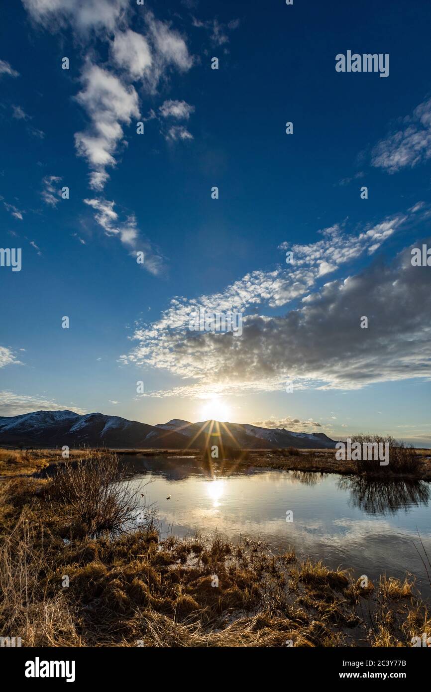 USA, Idaho, Sun Valley, Sunrise reflected in water Stock Photo