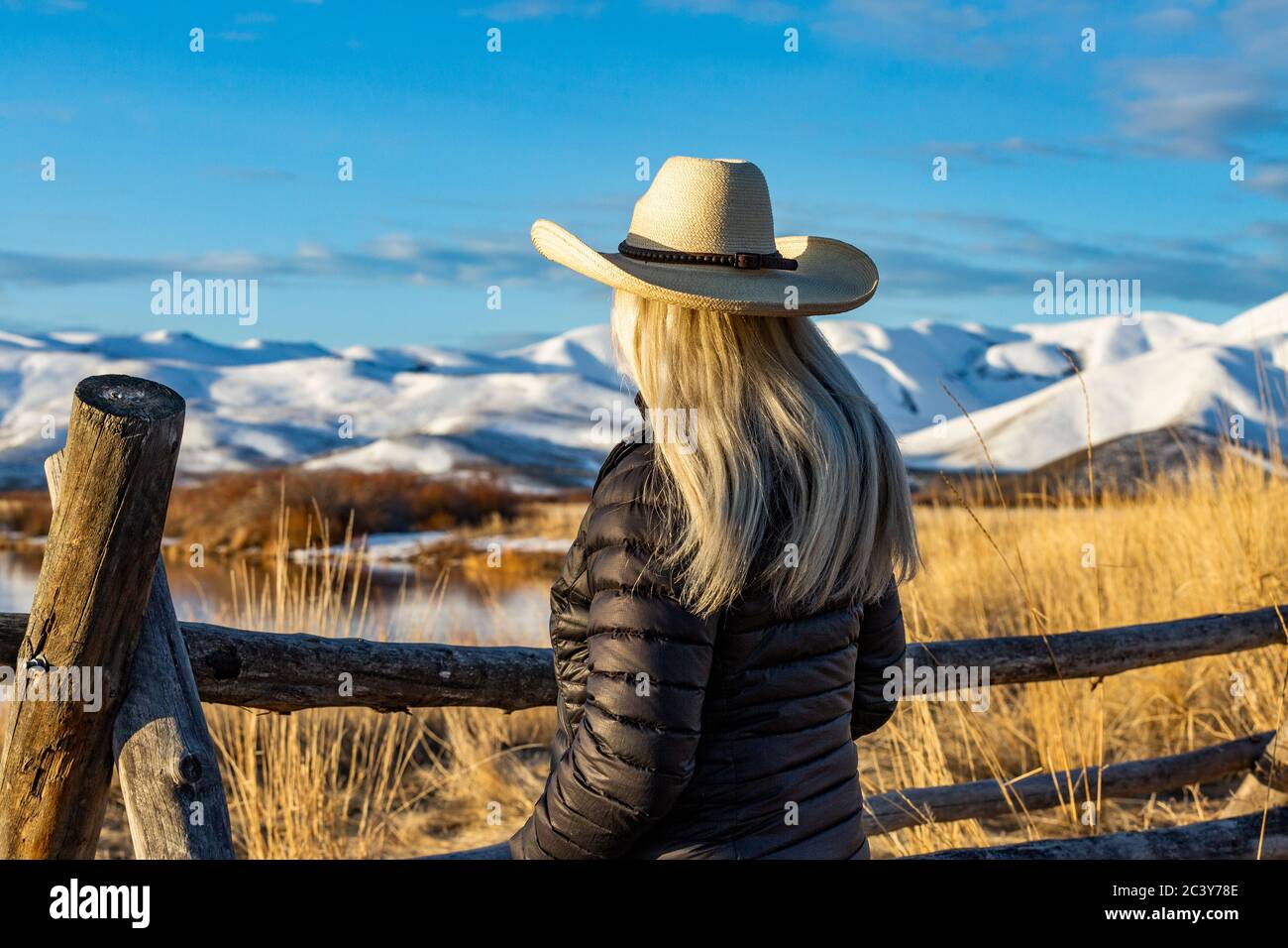 USA, Idaho, Sun Valley, Senior woman in cowboy hat looking at view Stock Photo