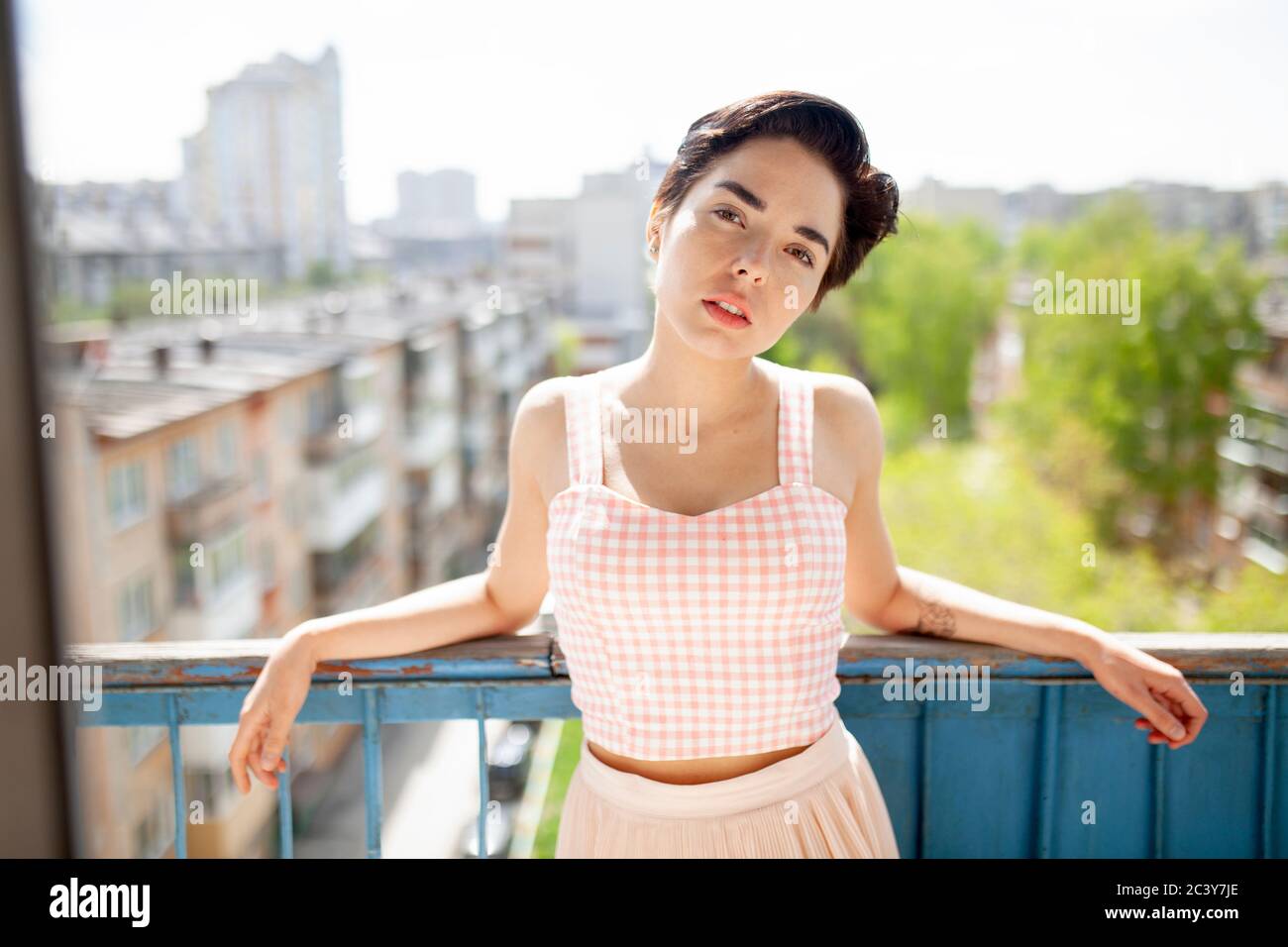 Russia, Novosibirsk, Portrait of young woman on balcony Stock Photo