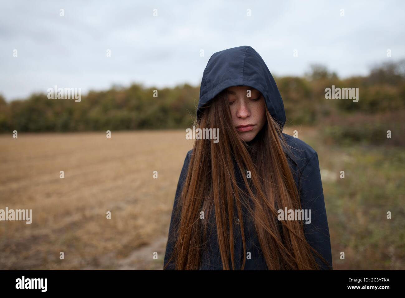 Russia, Omsk, Portrait of young woman in field Stock Photo