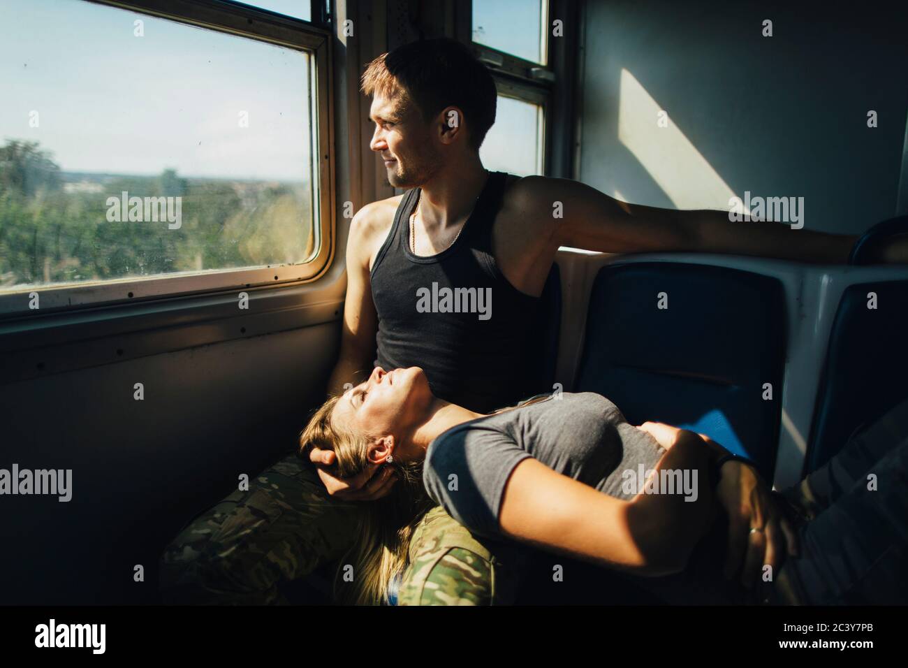 Young couple in train Stock Photo