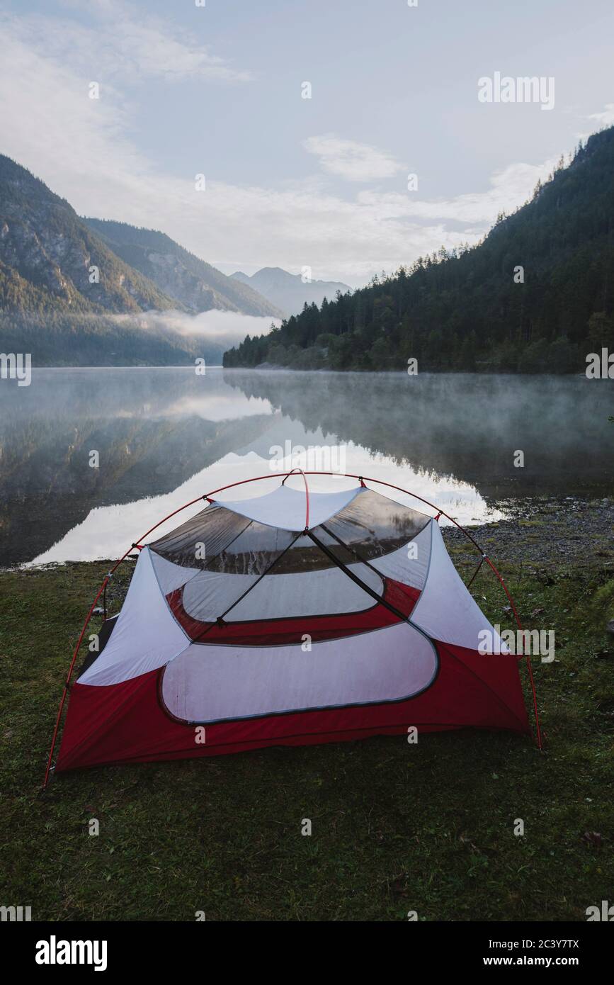 Austria, Plansee, Tent by lake Plansee at sunrise Stock Photo
