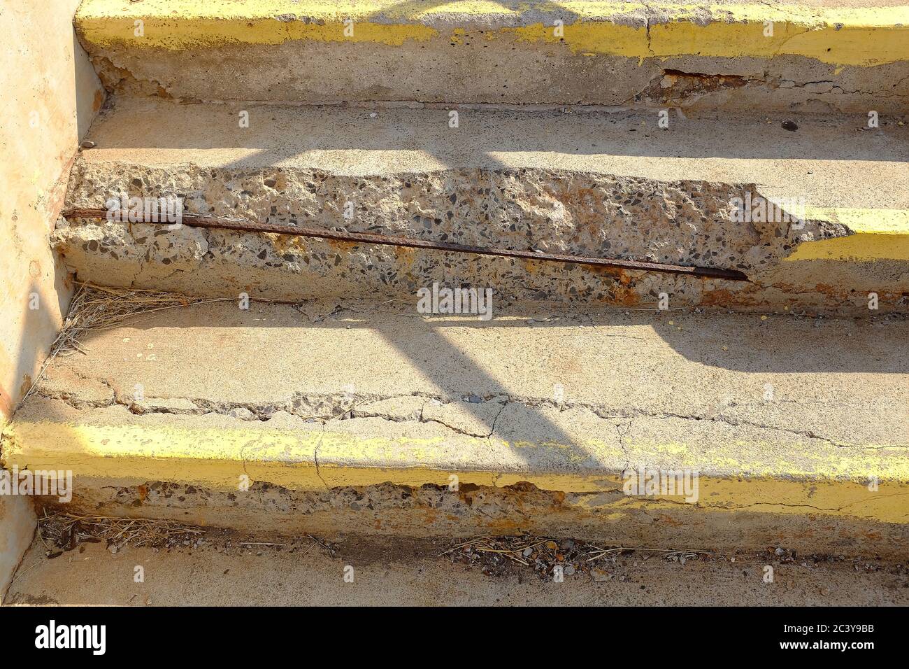 Decaying concrete sidewalk steps in need of replacement can cause injury. American infrastructure needs repair and replacement but government funding Stock Photo