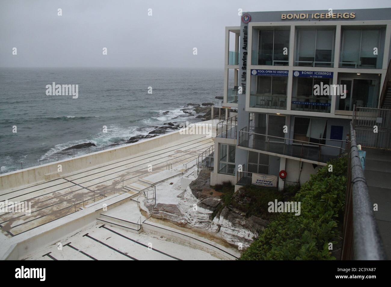 Bondi Icebergs restaurant at the southern end of Bondi Beach is popular with celebrities. It was closed on Christmas Day and the salt-water swimming p Stock Photo