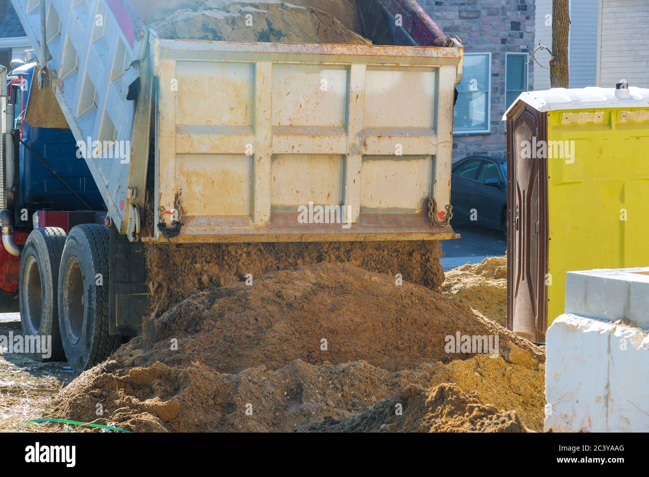 Truck pour soil on the ground in is under construction area Stock Photo