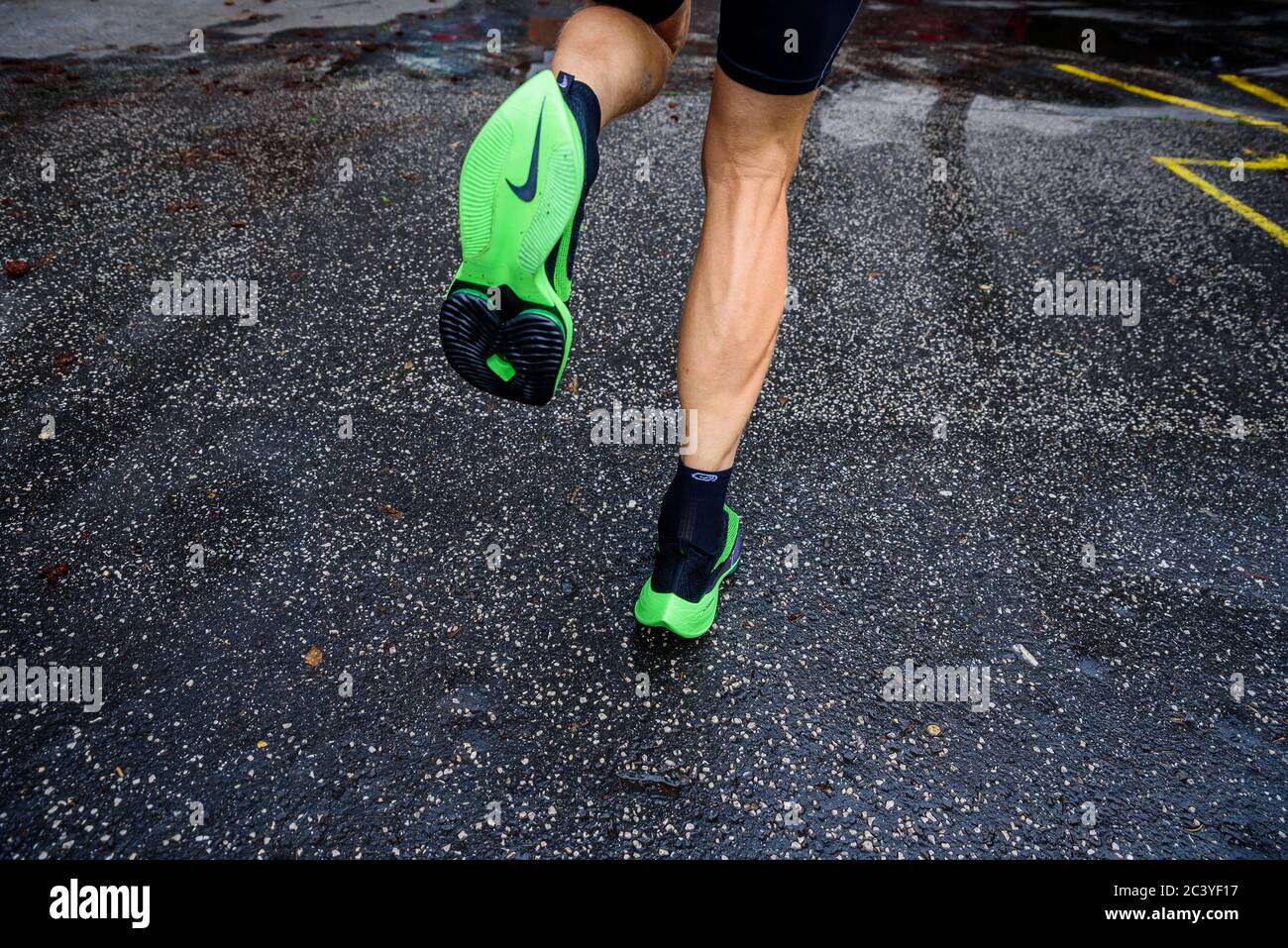 ROME, ITALY, JUNE 23. 2020: Nike running shoes ALPHAFLY NEXT%.  Controversial green athletics shoe on legs of professional athlete running  on the road Stock Photo - Alamy