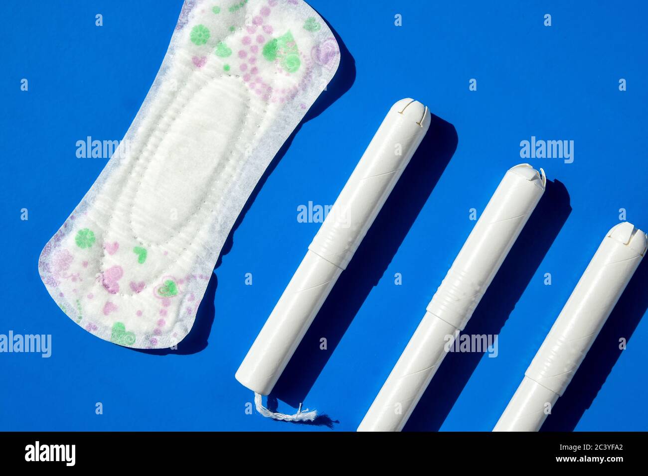 Hygienic tampons and sanitary pad on a blue background. copy space,  Menstruation woman hygiene protection. Critical days. Medical conception  Stock Photo - Alamy