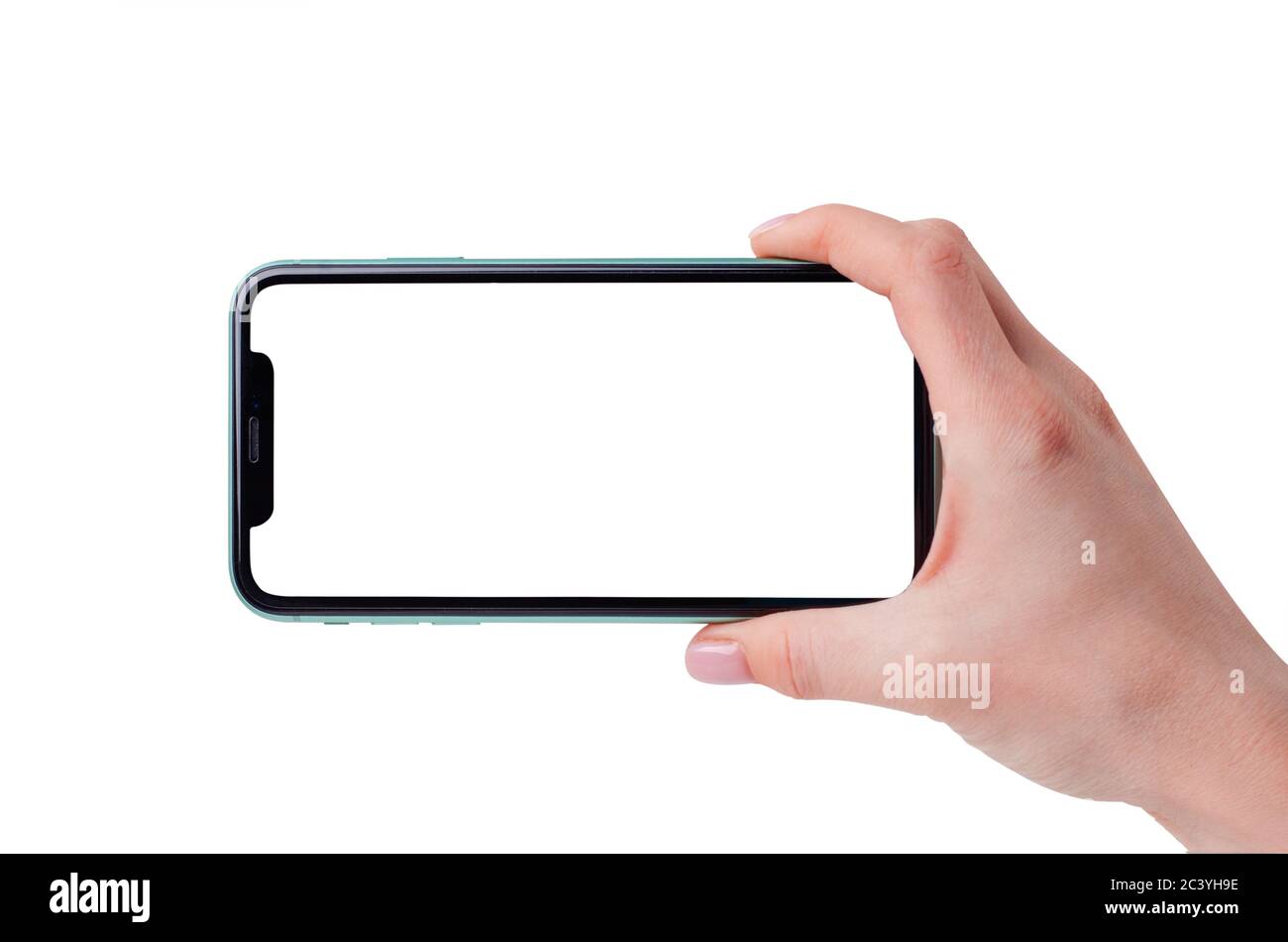Moscow, Russia - March 14, 2020: Green Apple iPhone 11 gorizontal mock up in a female hand isolated on a white background. Close-up of a new smartphon Stock Photo