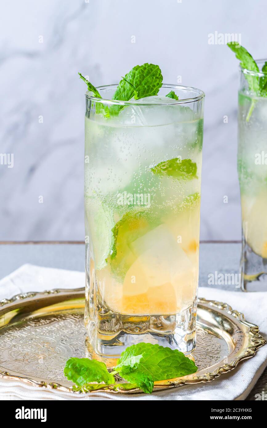 Mint infused Bramley Apple gin cocktail with elderflower cordial Stock Photo Alamy