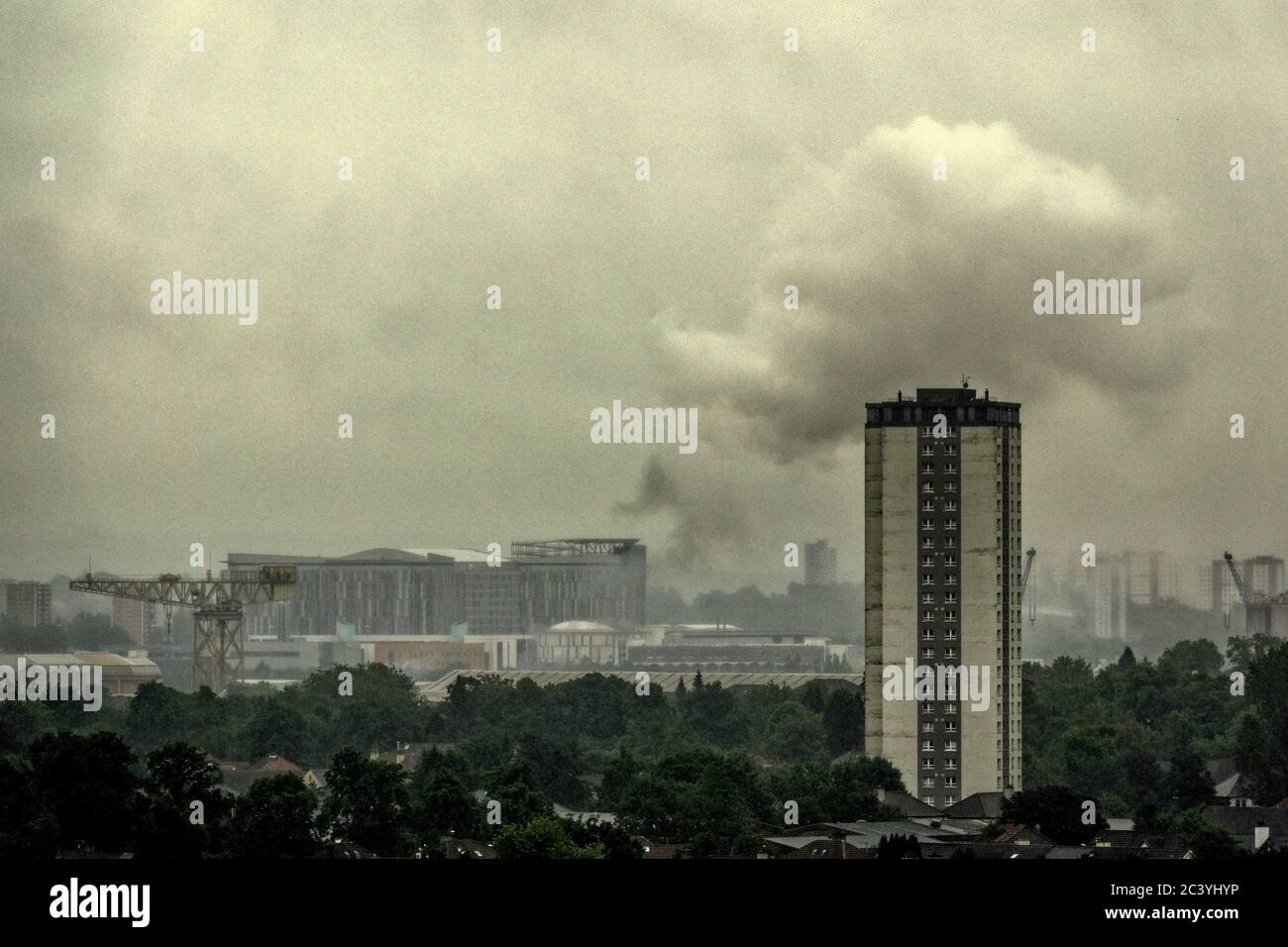 Glasgow, Scotland, UK 23rd June, 2020: Another fire in a town once known as tinderbox city as  an early morning explosion produced a tower of white smoke  in Govan near where the furloughed cruise ships are berthed with a third due this morning.. Credit: Gerard Ferry/Alamy Live News Stock Photo