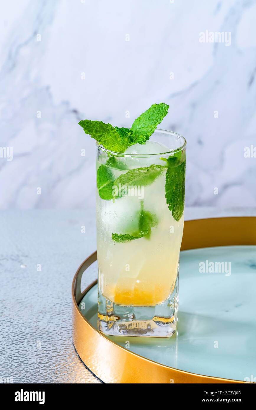 Mint infused Bramley Apple gin cocktail with elderflower cordial Stock Photo Alamy