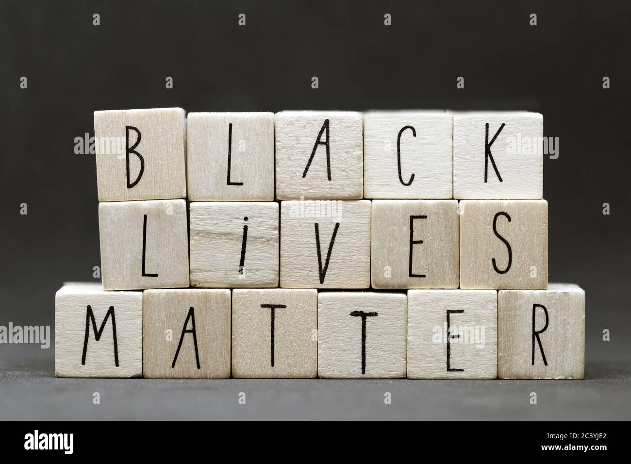 Wooden letters forming words 'Black lives matter' on dark black background Justice or blm concept Stock Photo