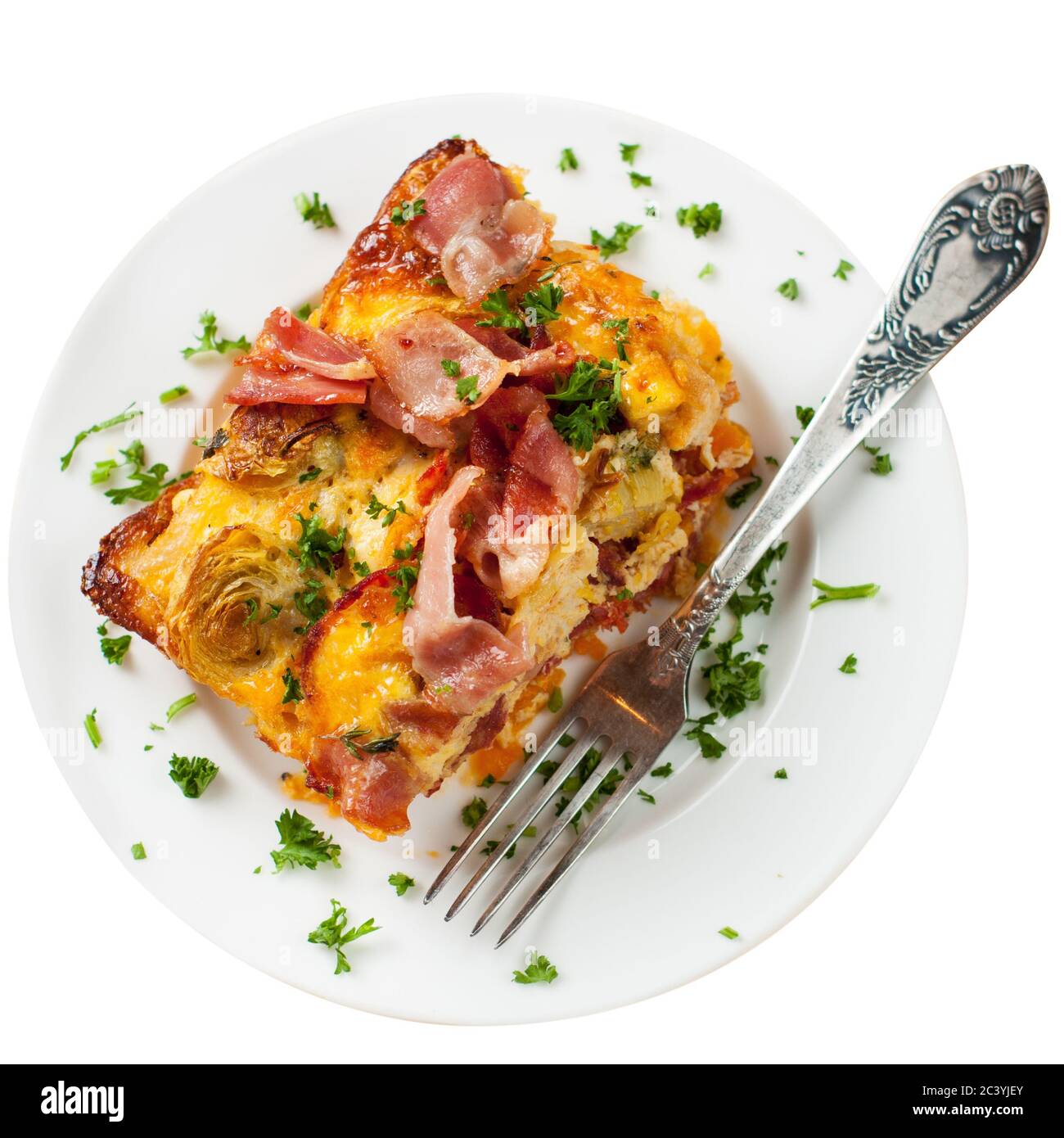 Cheesy casserole with sweet potatoes, bacon, eggs and cherry tomatoes