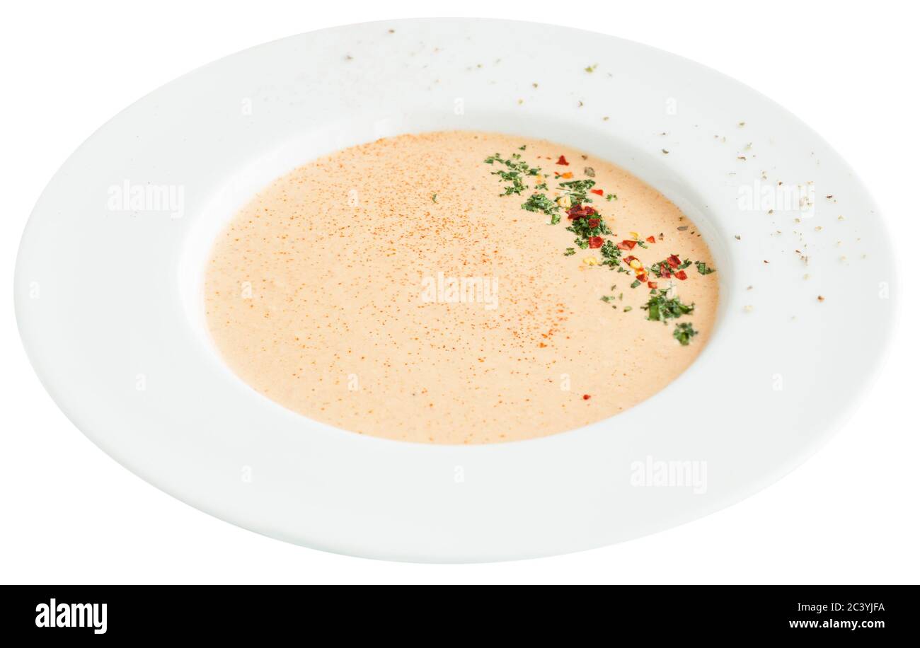 Creamy crab soup bisque with spices. Isolated on white background Stock