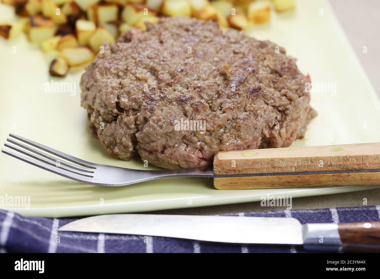 ground beef steak and hash browns Stock Photo Alamy