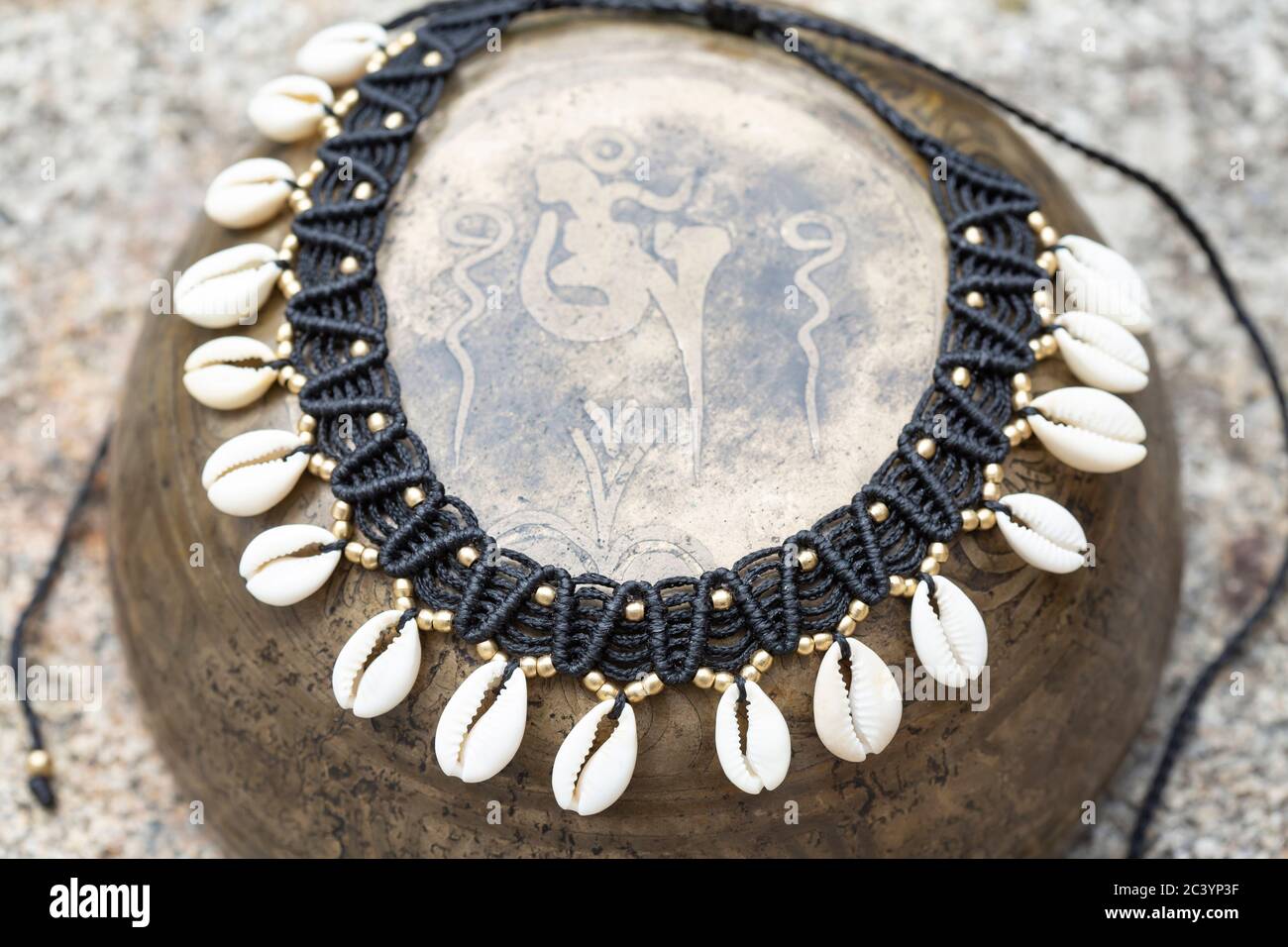 Macrame boho necklace with white shells on vintage metal background Stock Photo Alamy