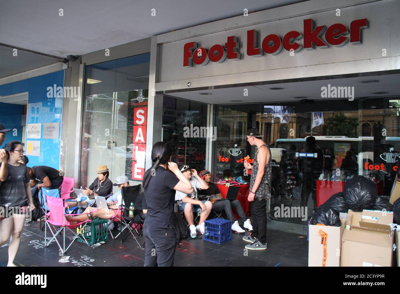 People begin queuing outside Locker on George Street Sydney for Nike Air Jordan Lab 5's. Some in the queue wear Ait Jordan trainers Stock Photo - Alamy