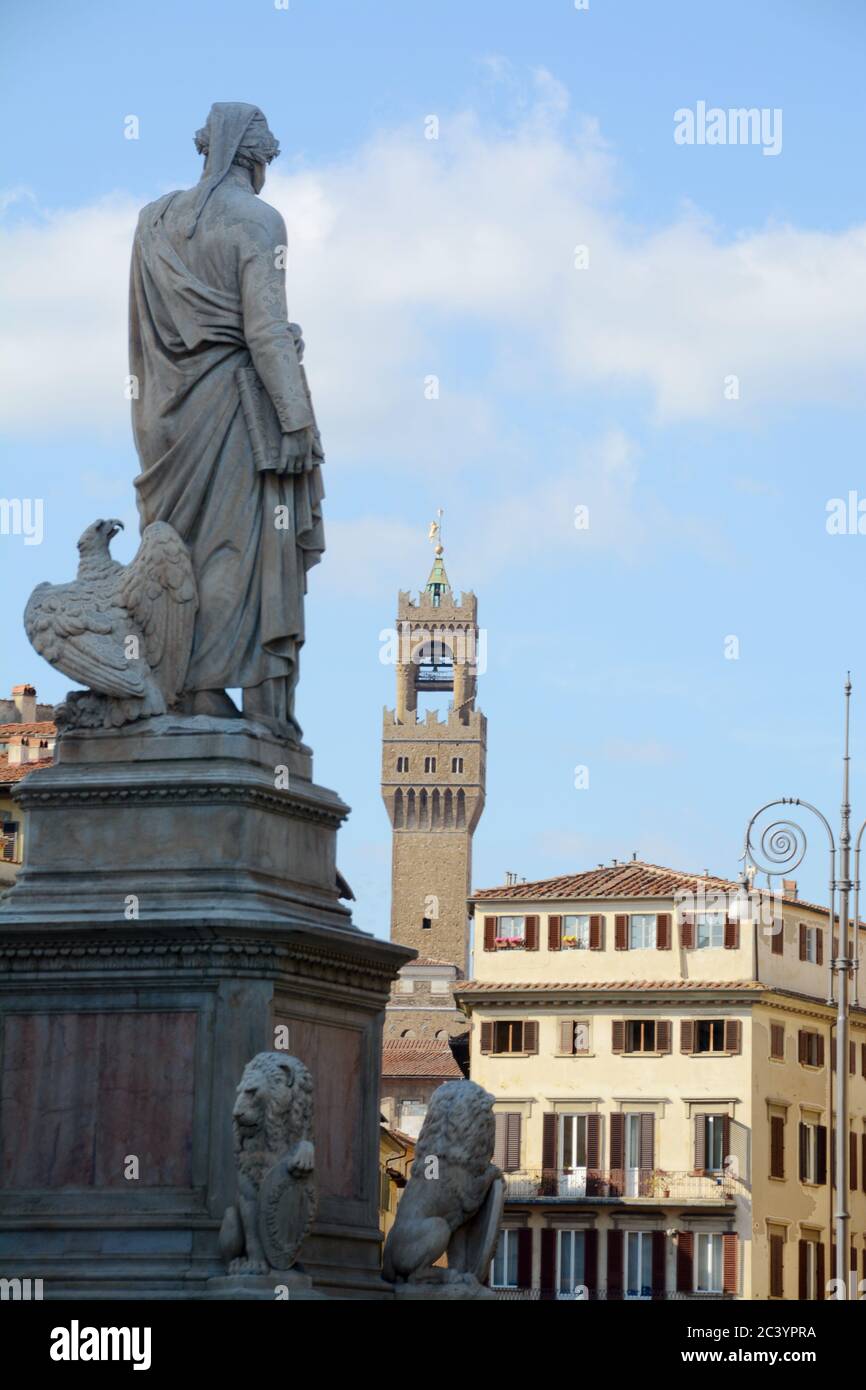The historic buildings of Piazza Santa Croce in Florence and in the background the tower of Arnolfo overlooking Palazzo Vecchio in Piazza della Signor Stock Photo