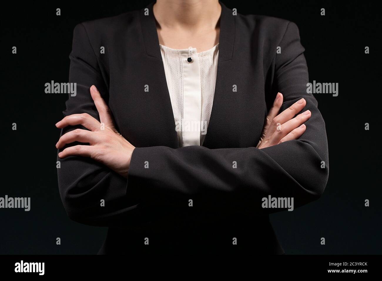 woman folds her arms over her chest Stock Photo Alamy