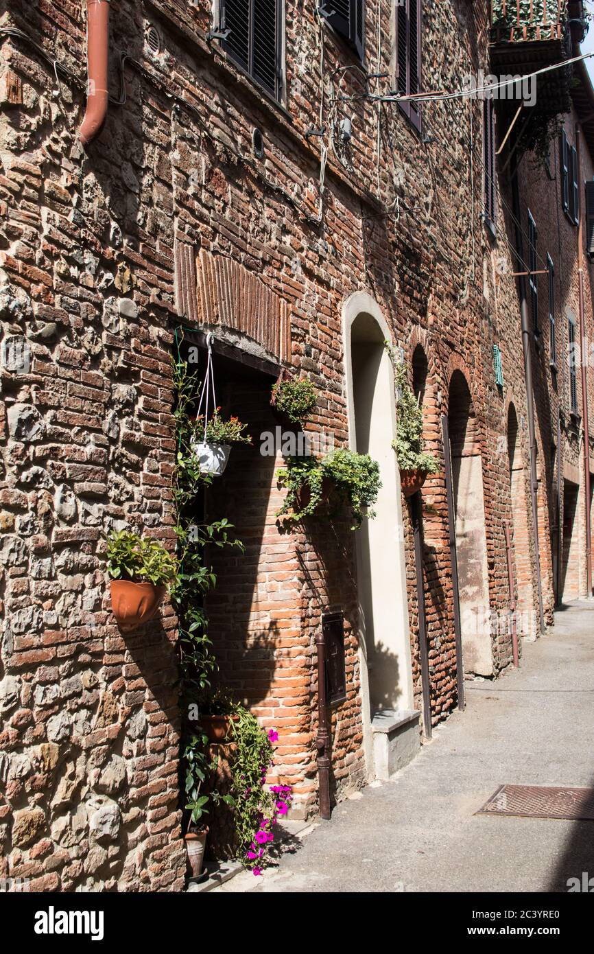 Facade and doors of an ancient brick house of a medieval village in ...