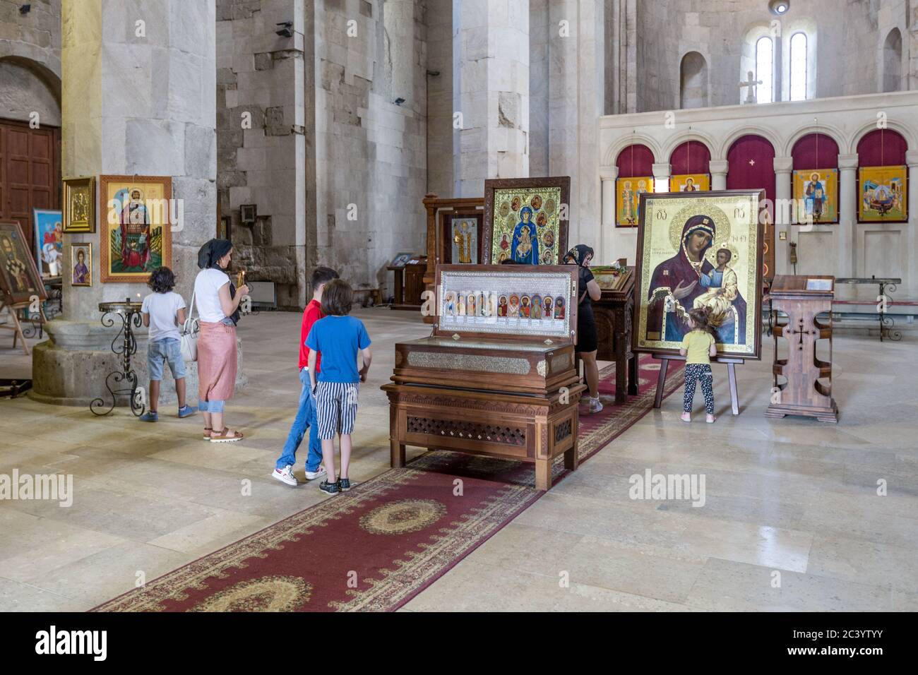 Prayers: Interior, Bagrati Cathedral aka Cathedral of the Dormition, or the Kutaisi Cathedral, is an 11th-century cathedral ,Kutaisi, Imereti region o Stock Photo