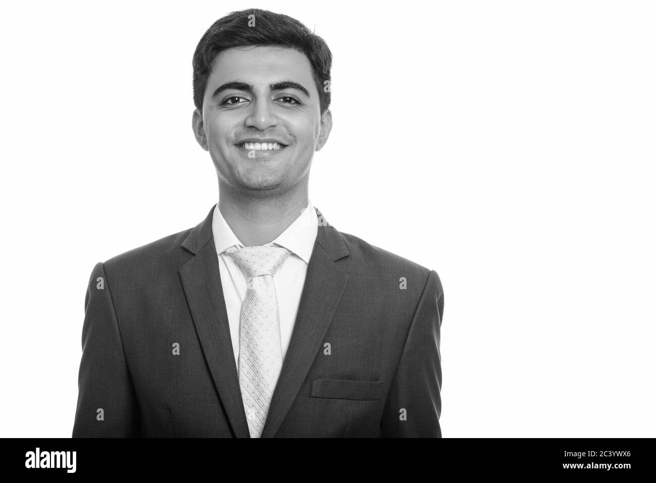 Portrait of happy young handsome Persian businessman smiling Stock ...