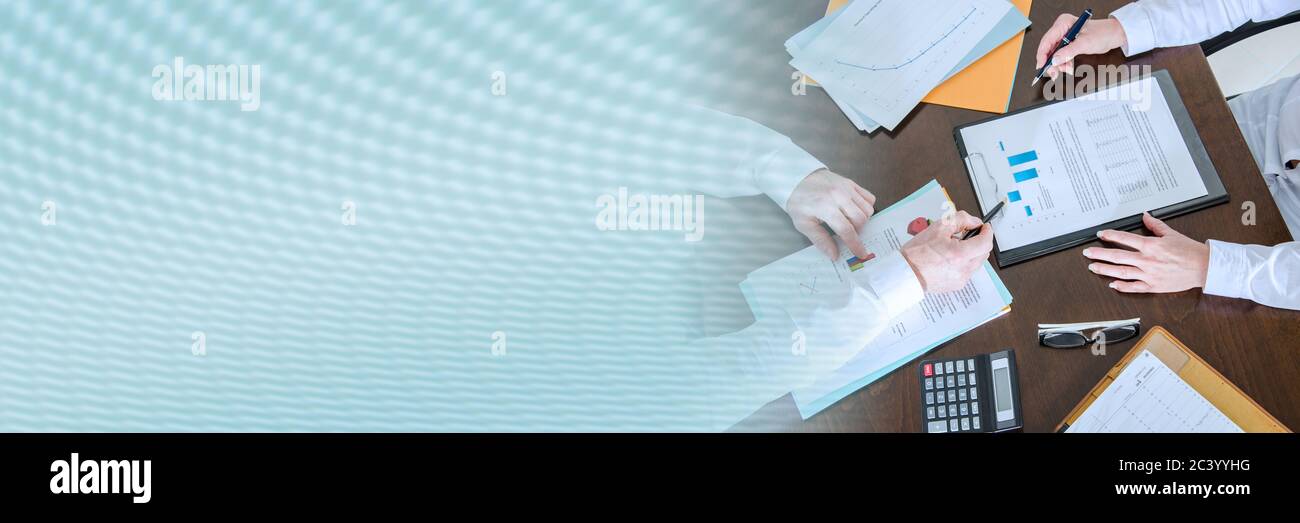 Two business people analyzing charts; panoramic banner Stock Photo - Alamy