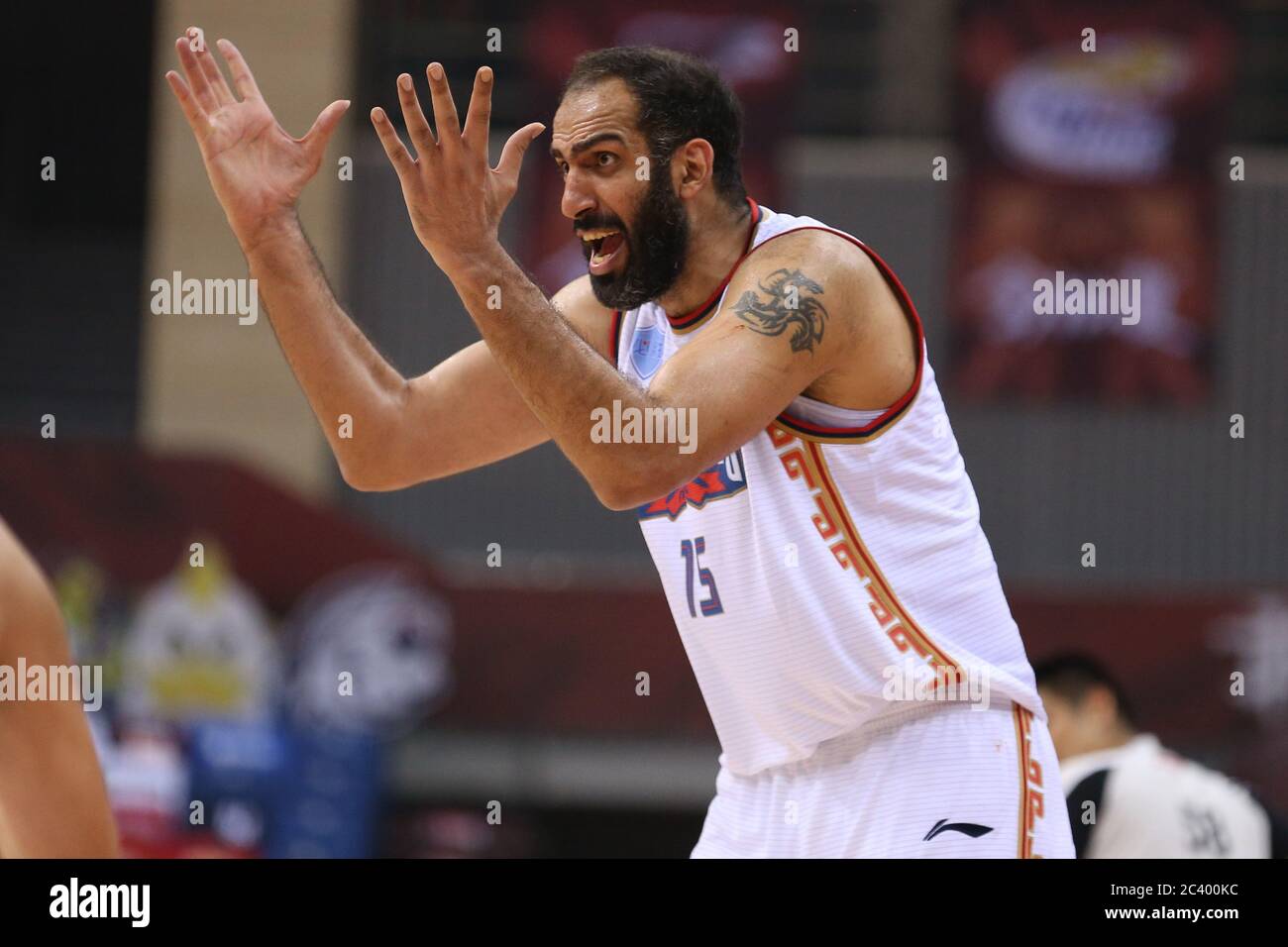 Iranian professional basketball player Hamed Haddadi of Nanjing Tongxi  Monkey King reacts during a game at the first stage of Chinese Basketball  Association (CBA) resumption against Zhejiang Guangsha Lions, Qingdao city,  east