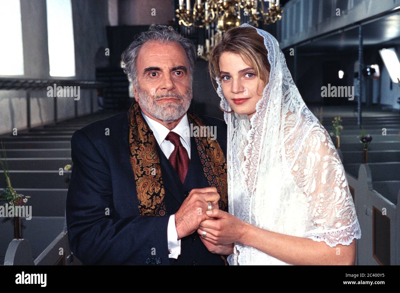 June 24th, 2002, Rinkenis, Denmark, Maximilian Schell and Rike Schmid at a  press meeting for the ZDF series Der Furst und das Madchen. Still picture  as a newlyweds in the church of