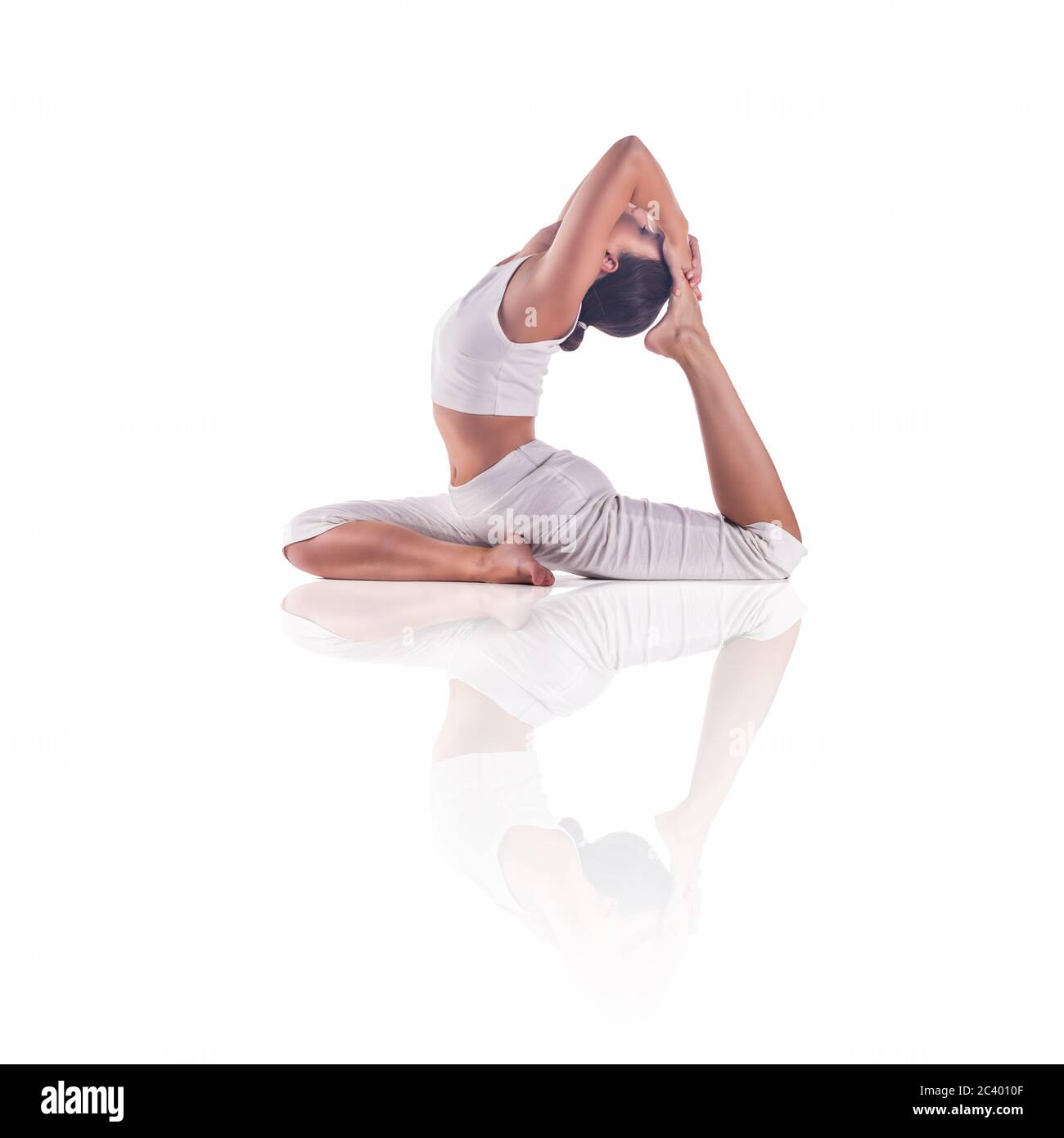 Woman Practicing Yoga Doing The King Pigeon Pose Eka Pada Rajakapotasana Stock Photo Alamy