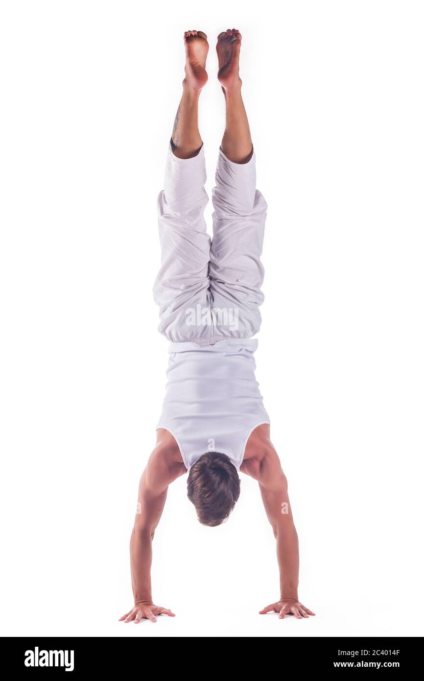 Man practicing yoga doing the  Downward-facing Tree Pose  posture. Adho  Mukha Vrksasana Stock Photo - Alamy