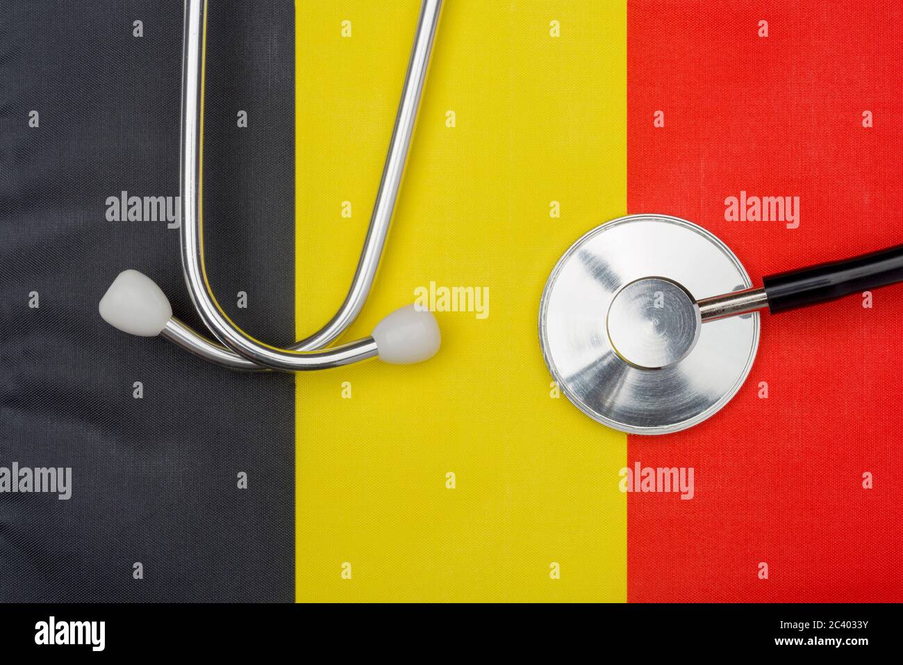 Belgian flag and stethoscope. The concept of medicine. Stethoscope on the flag in the background. Stock Photo