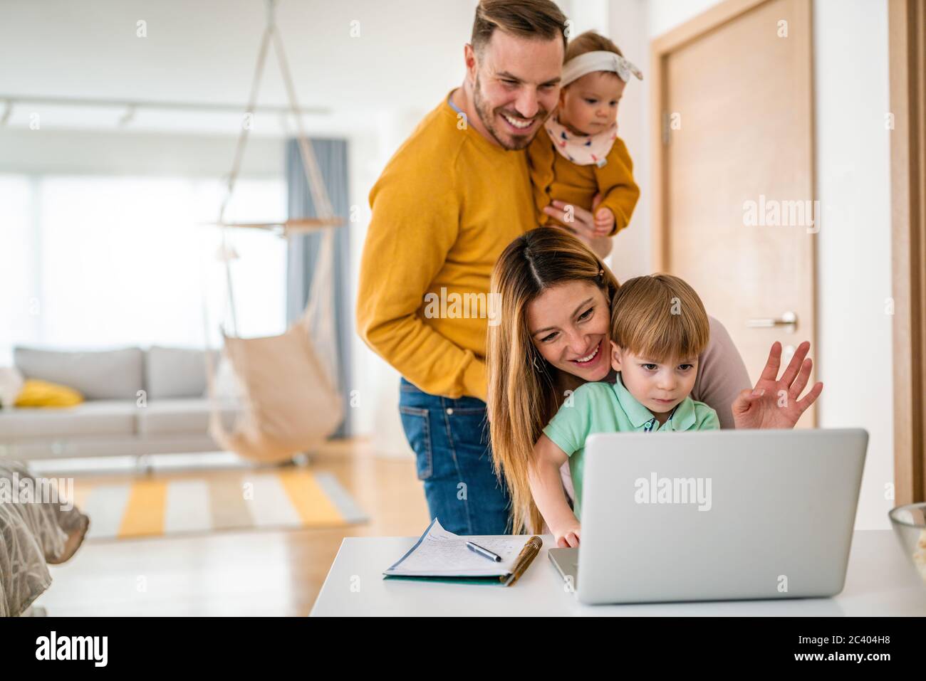 Happy family with home hi-res stock photography and images - Alamy