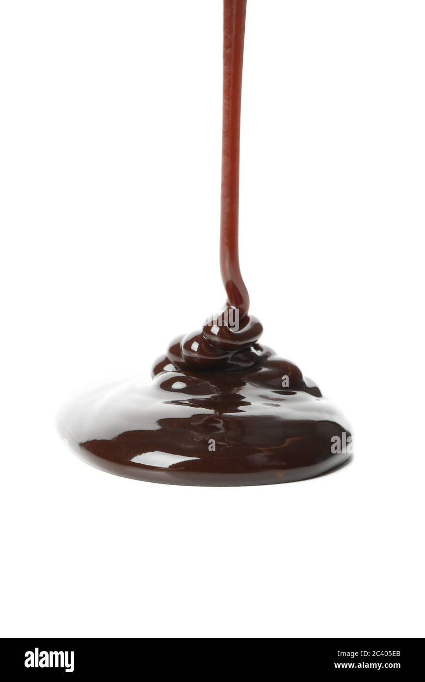 Melted chocolate is pouring, isolated on white background Stock Photo