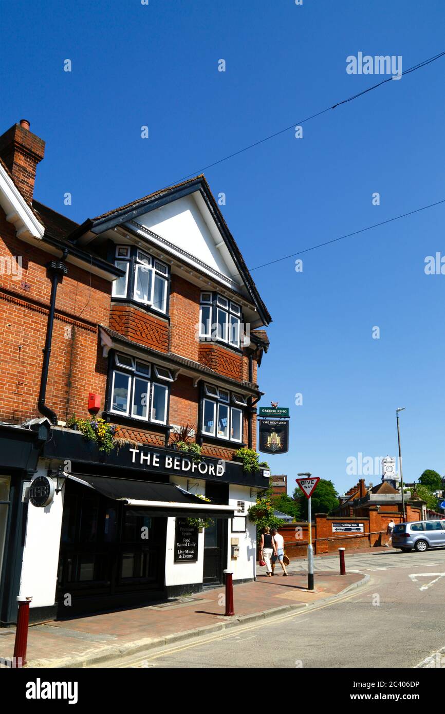 The Bedford public house on corner of High Street and Vale Road, train station in background, Royal Tunbridge Wells, Kent, England Stock Photo