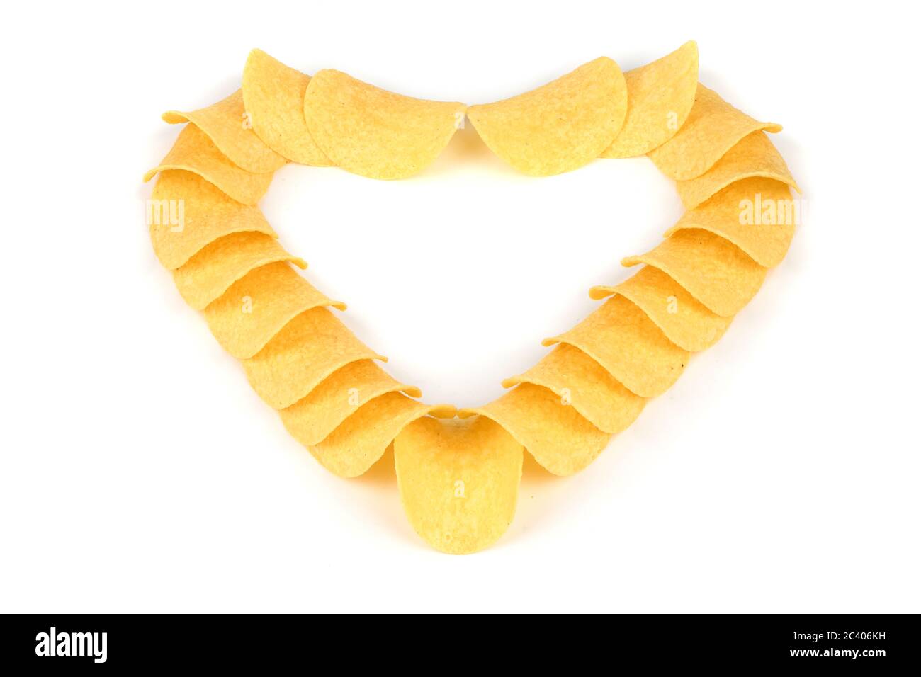 Tasty crispy potato chips in heart shape isolated on white background