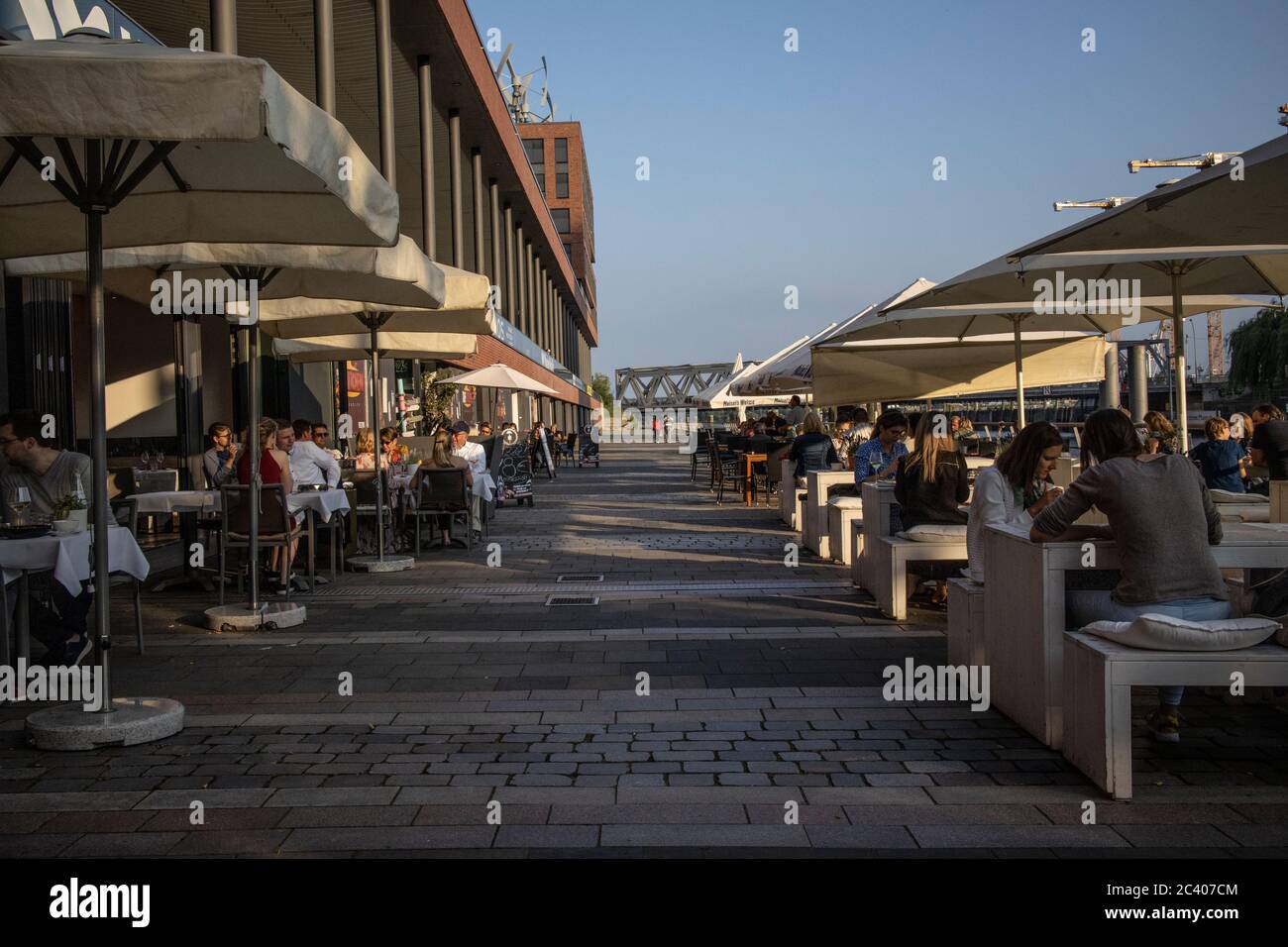 People return to eating at restaurants after the coronavirus pandemic lockdown restrictions are relaxed in Hamburg, Germany Stock Photo