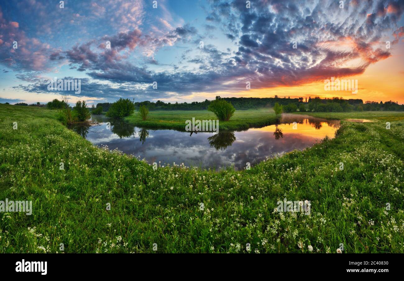 Beautiful spring sunrise over river banks Stock Photo - Alamy