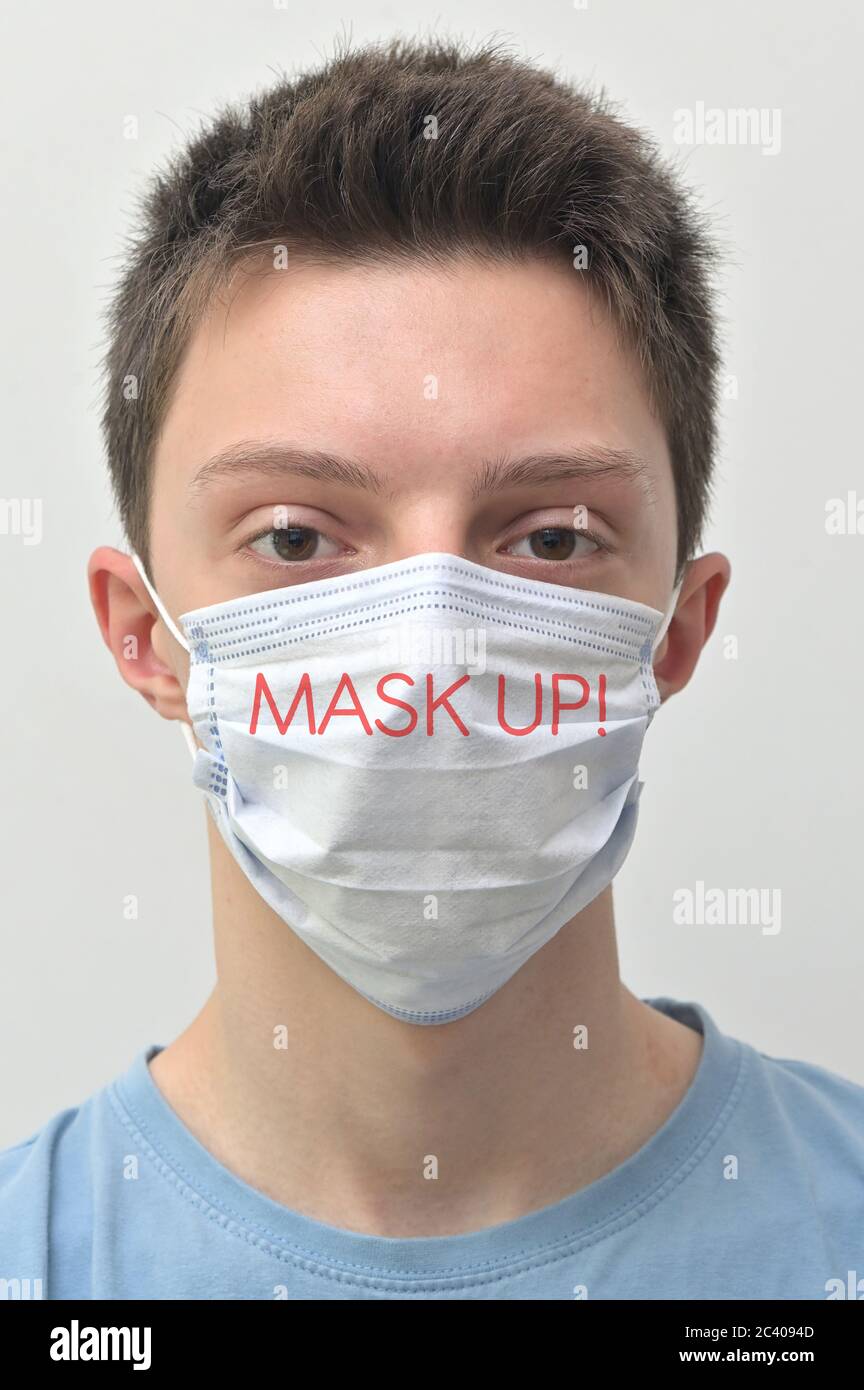 Portrait Of Young Man Wearing Medical Mask With Tagline Words Stock ...