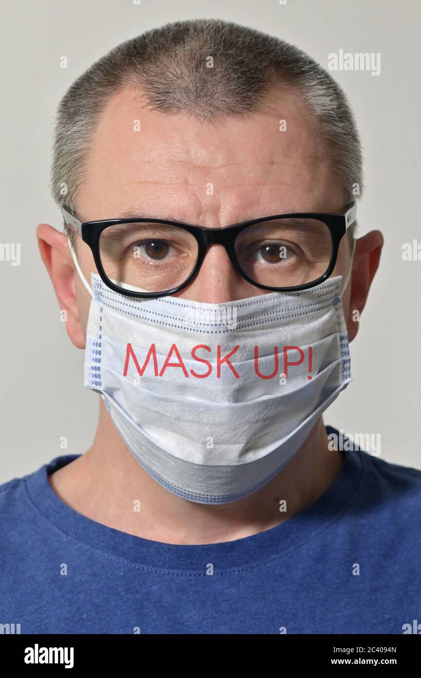 Portrait Of Man Wearing Medical Mask With Tagline Words Stock Photo - Alamy