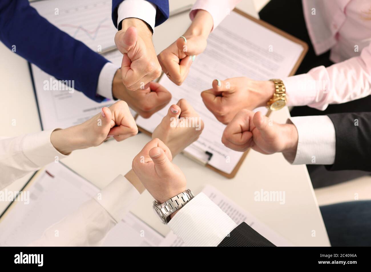 Group of business people giving thumbs up Stock Photo - Alamy