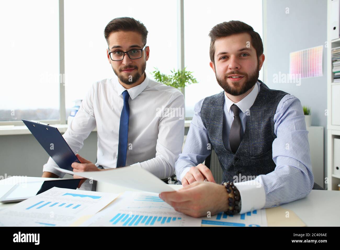 Joyful business colleagues working together in office Stock Photo