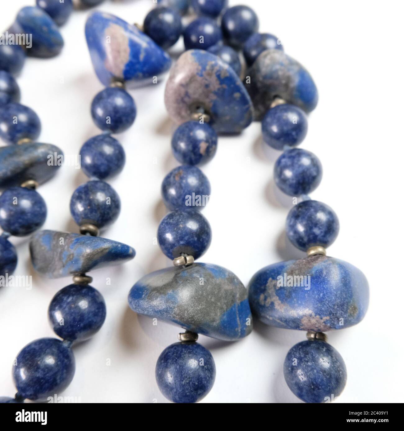 Closeup of a necklace handmade from semi-precious stones Lapis Lazuli Stock Photo